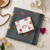 Timeless Black Linen Cotton Checks Saree with Subtle Floral Prints & White Floral Blouse