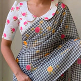 Timeless Black Linen Cotton Checks Saree with Subtle Floral Prints & White Floral Blouse