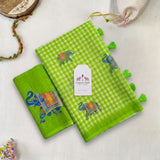 Vibrant Green Linen Cotton Checks Saree with Elephant Design & White Floral Blouse
