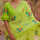 Vibrant Green Linen Cotton Checks Saree with Elephant Design & White Floral Blouse