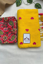 Bright yellow cotton handloom saree with red printed blouse